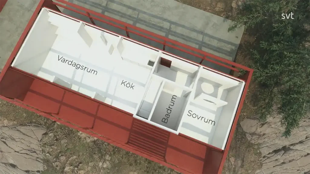 Stiligt - En vy uppifrån av en planlösning för ett litet hus med märkta rum: Vardagsrum (vardagsrum), Kök (kök), Badrum (badrum) och Sovrum (sovrum).