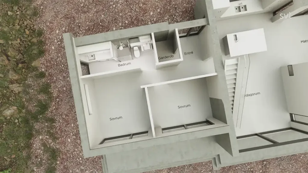 Stiligt - Ovanifrån av en planlösning för huset som visar märkta rum: två sovrum (Sovrum), badrum (Badrum), entré (Entre), garderob (Garderob) och en del av kök och vardagsrum.