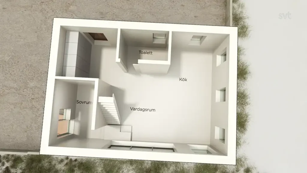Stiligt - En vy uppifrån av en enkel planlösning för huset med märkta rum: Sovrum (sovrum), Vardagsrum (vardagsrum), Kök (kök) och Toalett (toalett).